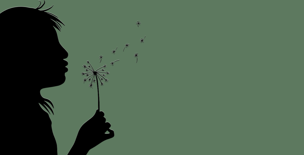 Green background with shadow of girl blowing a dandelion on top